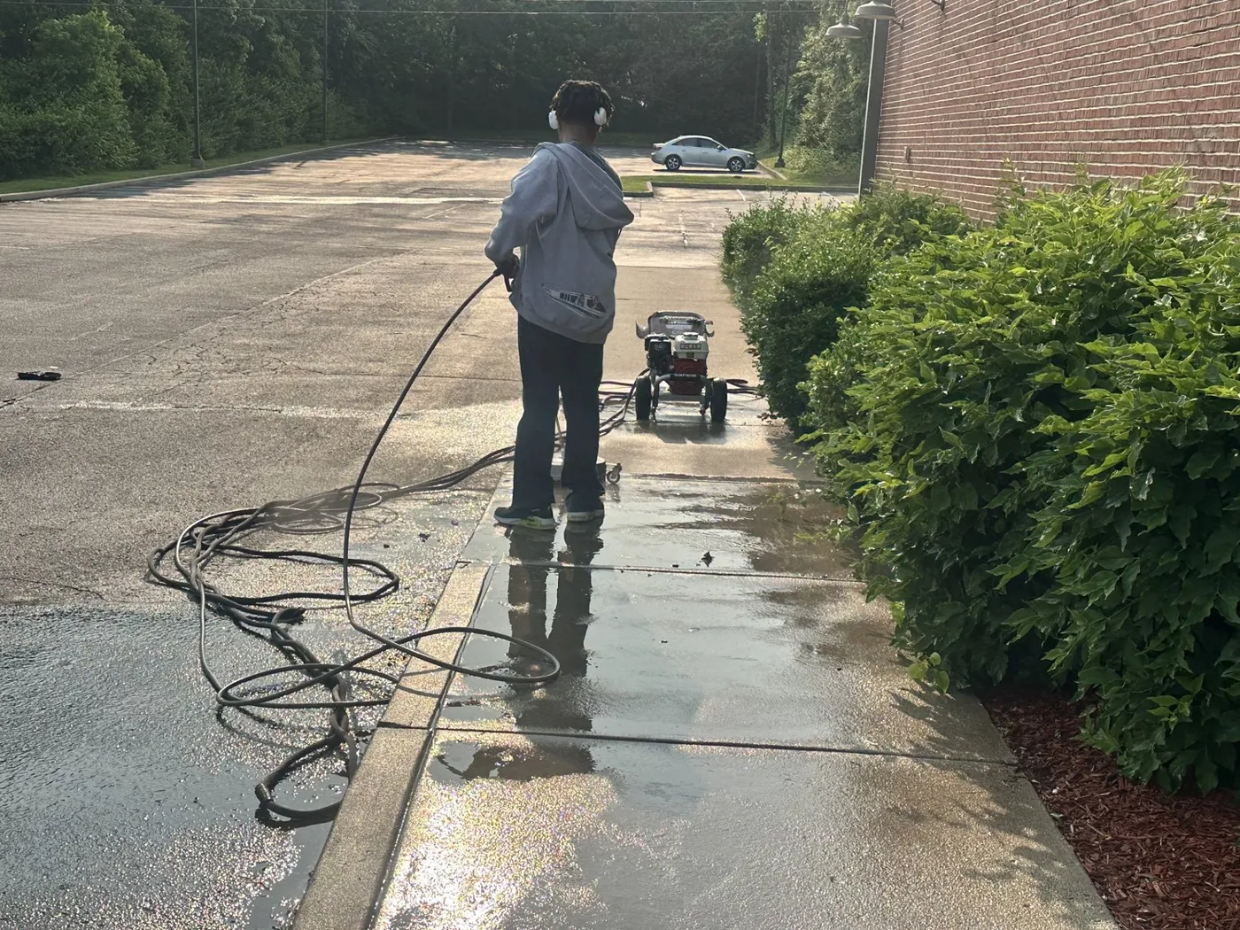 Pressure washing a commercial sidewalk